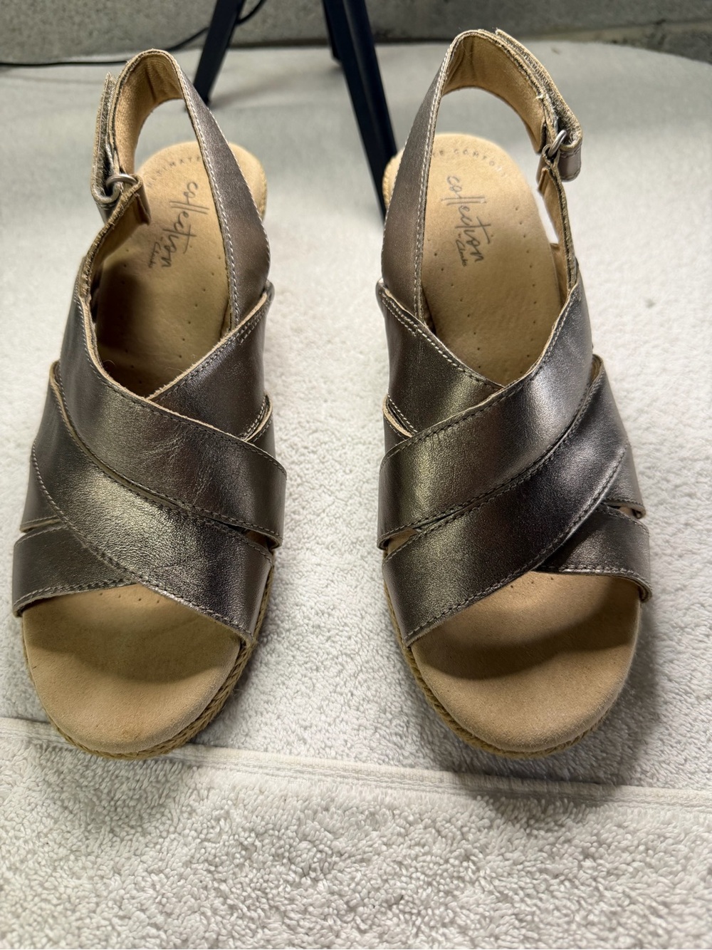 Collection by Clark’s bronze wedge sandals in size 7. Adjustable back
